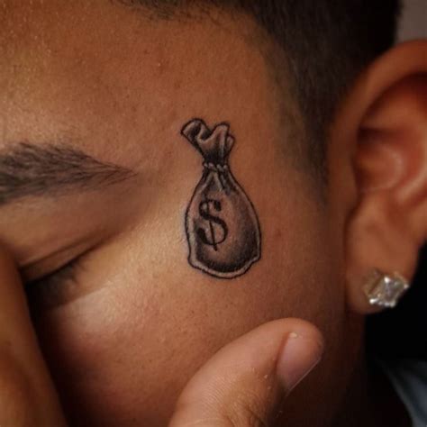 dollar sign face tattoo|More.